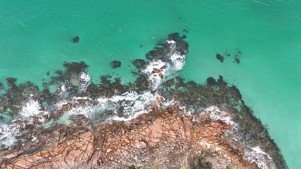 Stunning aerial view of Busselton's rocky coastline and turquoise ocean waters in Western Australia.