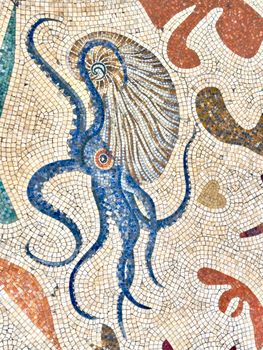 Vibrant mosaic tile art depicting a blue octopus, showcasing ancient Roman style.