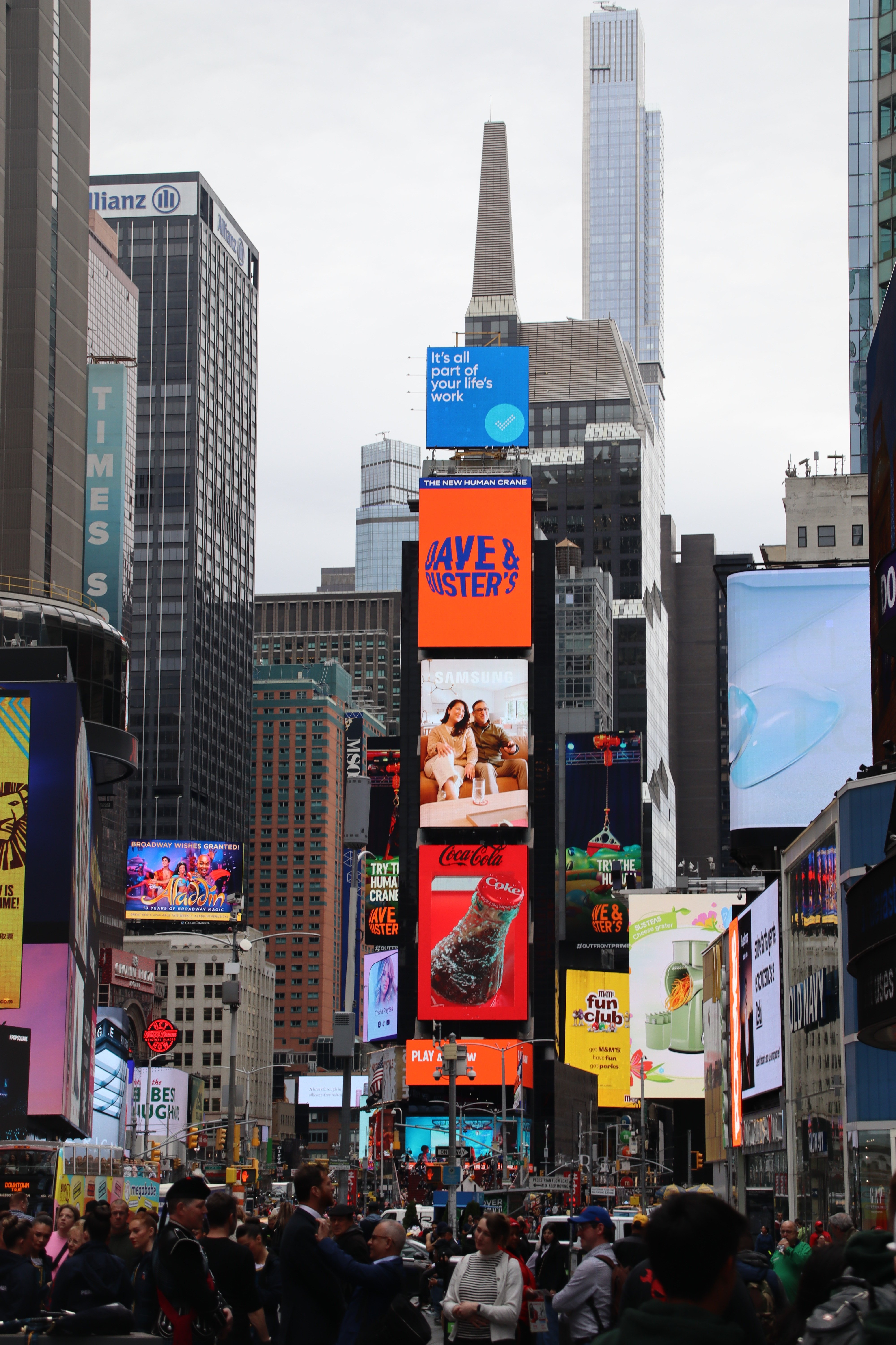 Dynamic view of Times Square featuring iconic billboards and bustling crowds in New York City.