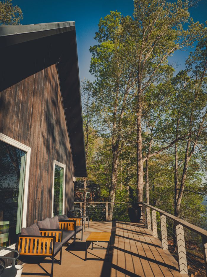 Timber-clad cabin exterior at dusk — photo by Courtney RA on Pexels