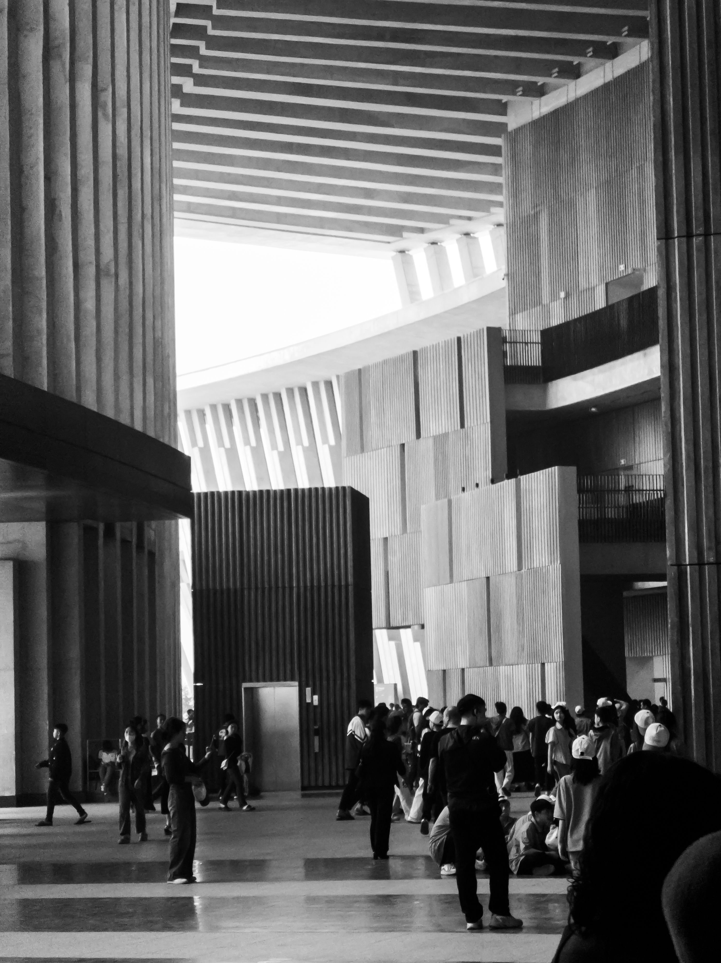Modern Architectural Interior with Visitors · Free Stock Photo