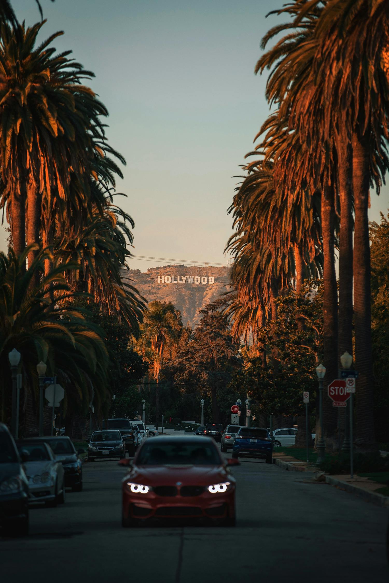 The Hollywood sign on the mountains is visible from the road in LA.