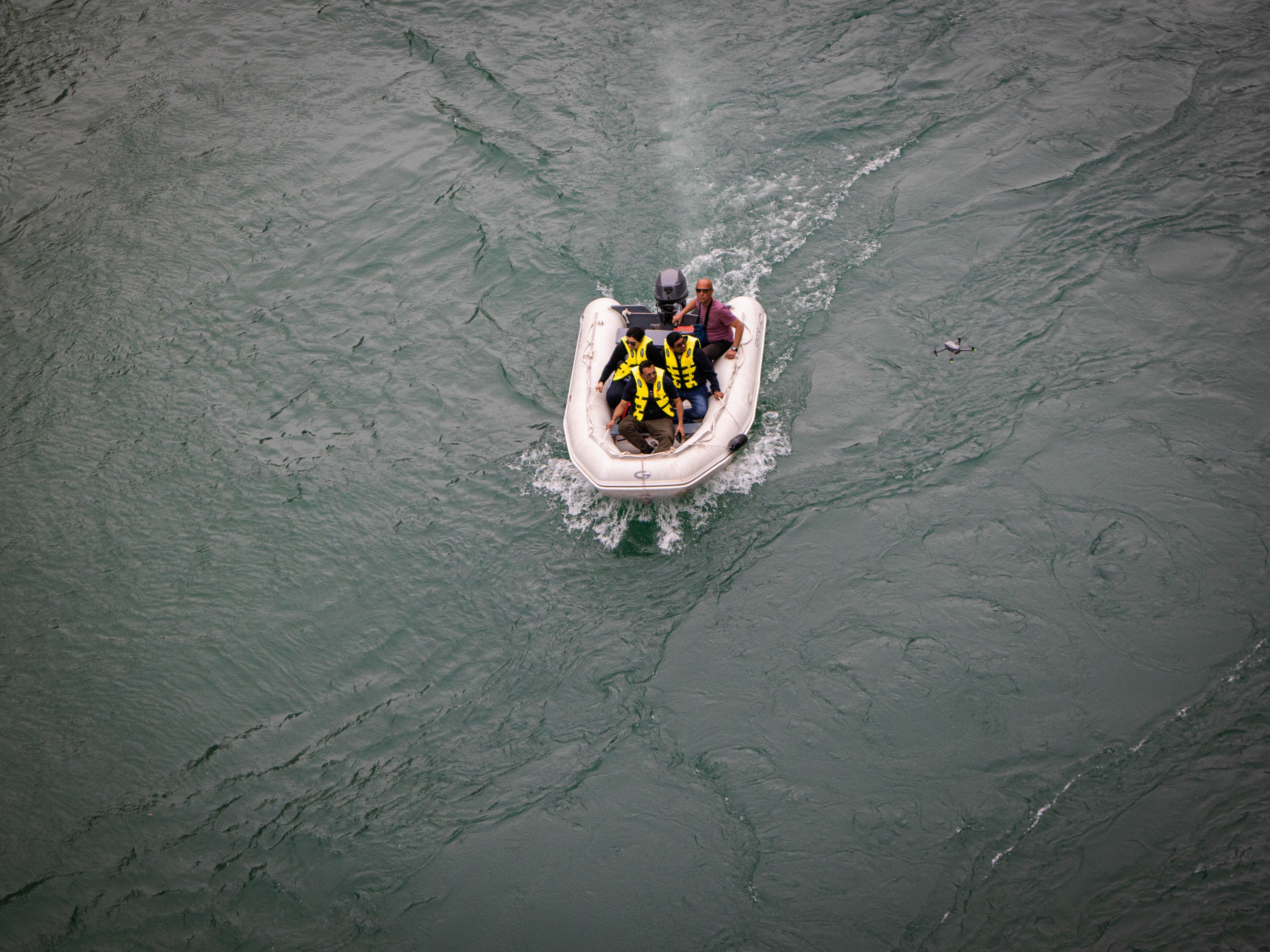 Aerial view of a rubber raft navigating the waters of the Neretva River.
