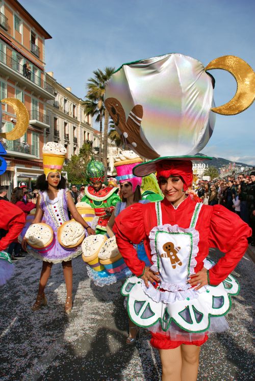 Free Vibrant carnival performers in elaborate costumes parading in Menton, France. Stock Photo
