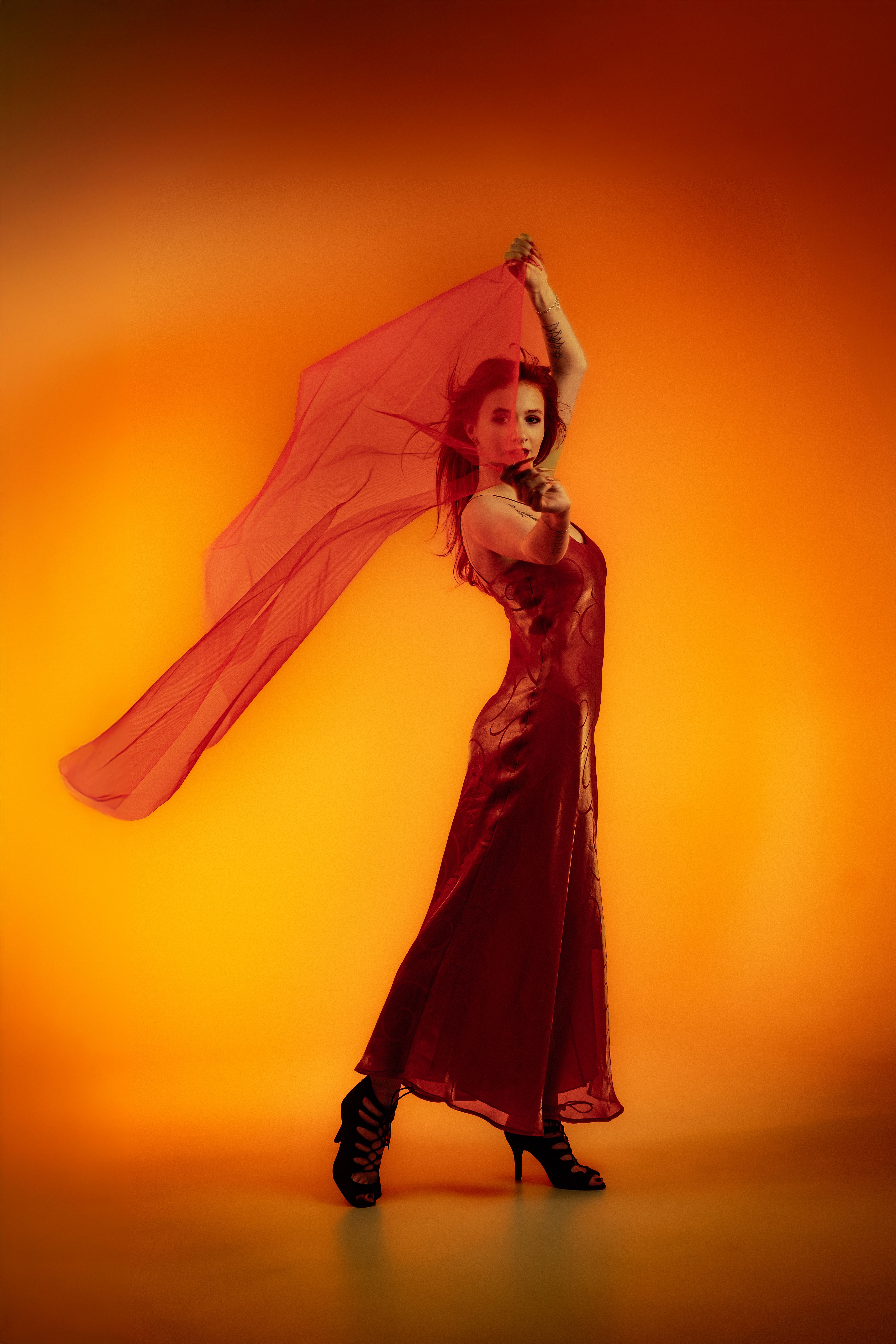 Elegant Woman Posing in Red Dress with Veil · Free Stock Photo