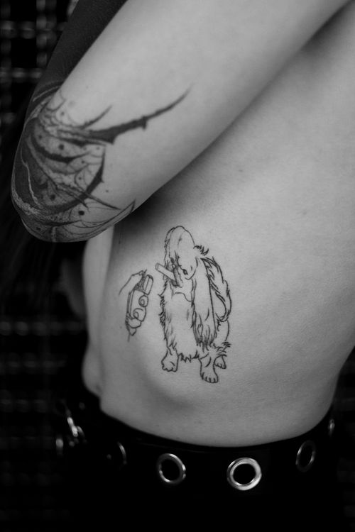 Free Close-up of a unique arm tattoo on a person's body in black and white. Stock Photo