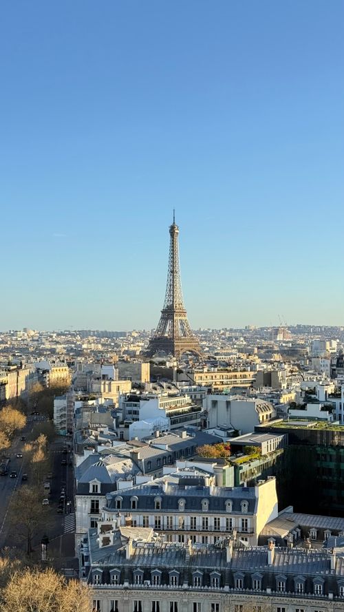 Free Breathtaking aerial view of Paris featuring the iconic Eiffel Tower on a clear day. Stock Photo