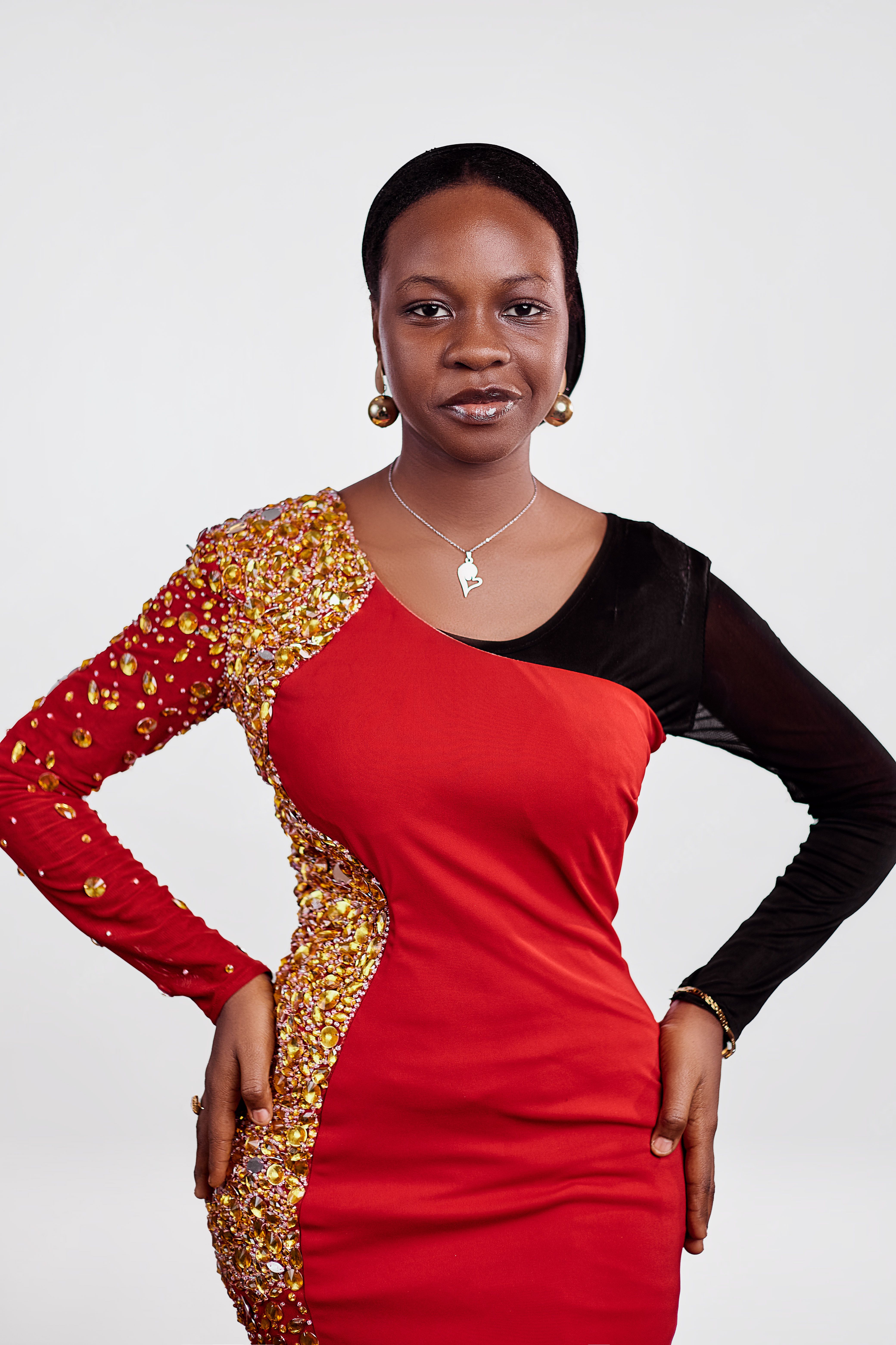 Elegant Woman in Red and Black Dress Posing · Free Stock Photo