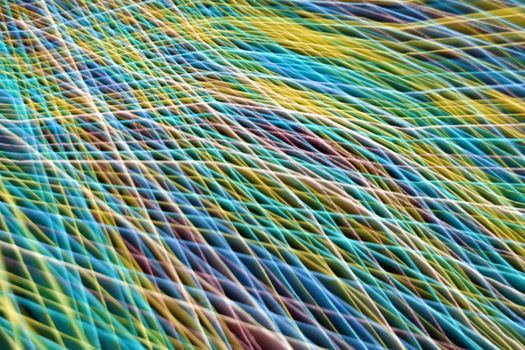 Dynamic multicolored abstract pattern resembling waves, captured in Guaratuba, Brazil.