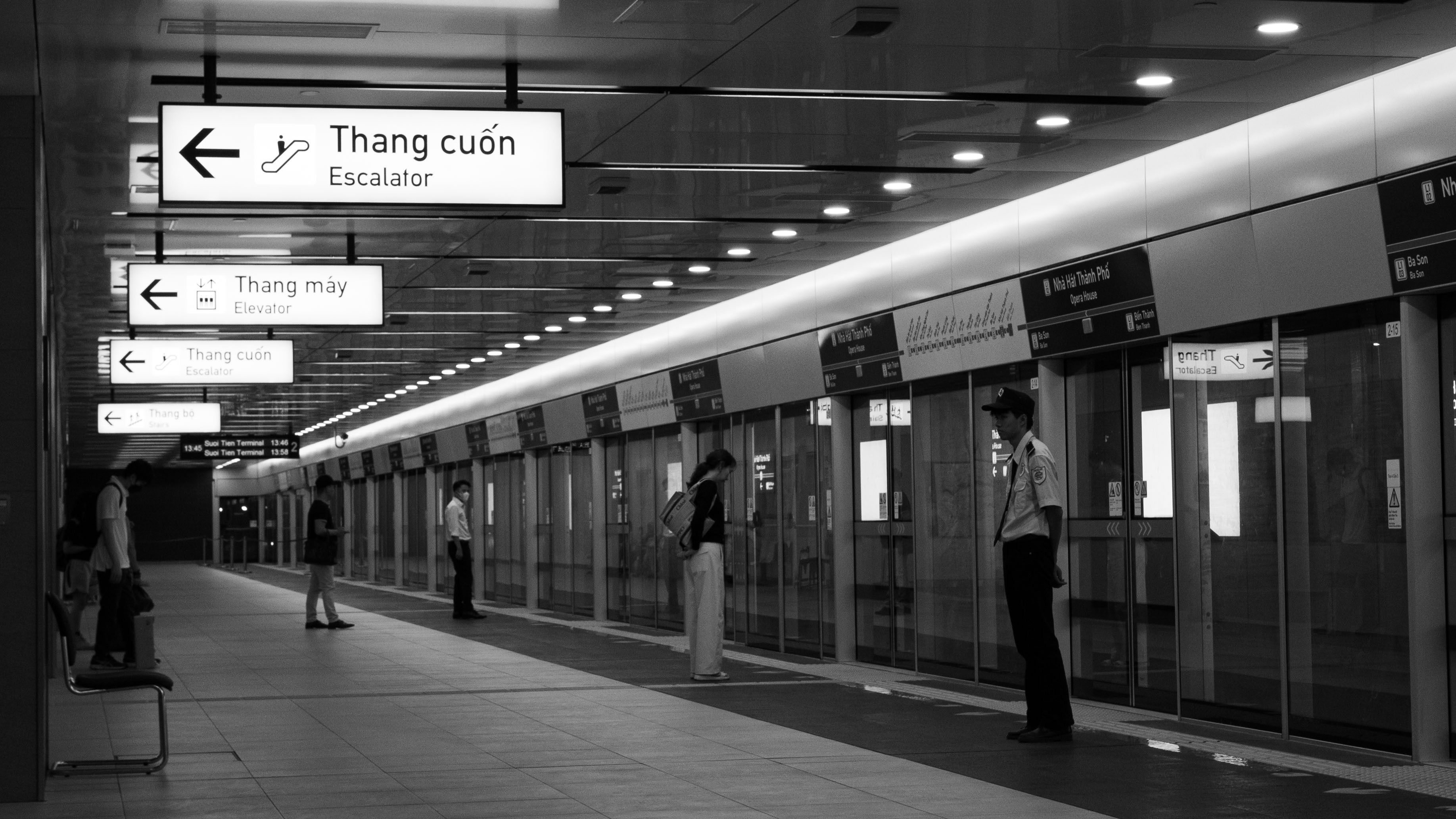 Commuters on a Toronto transit platform as offices reopen near the Eglinton line