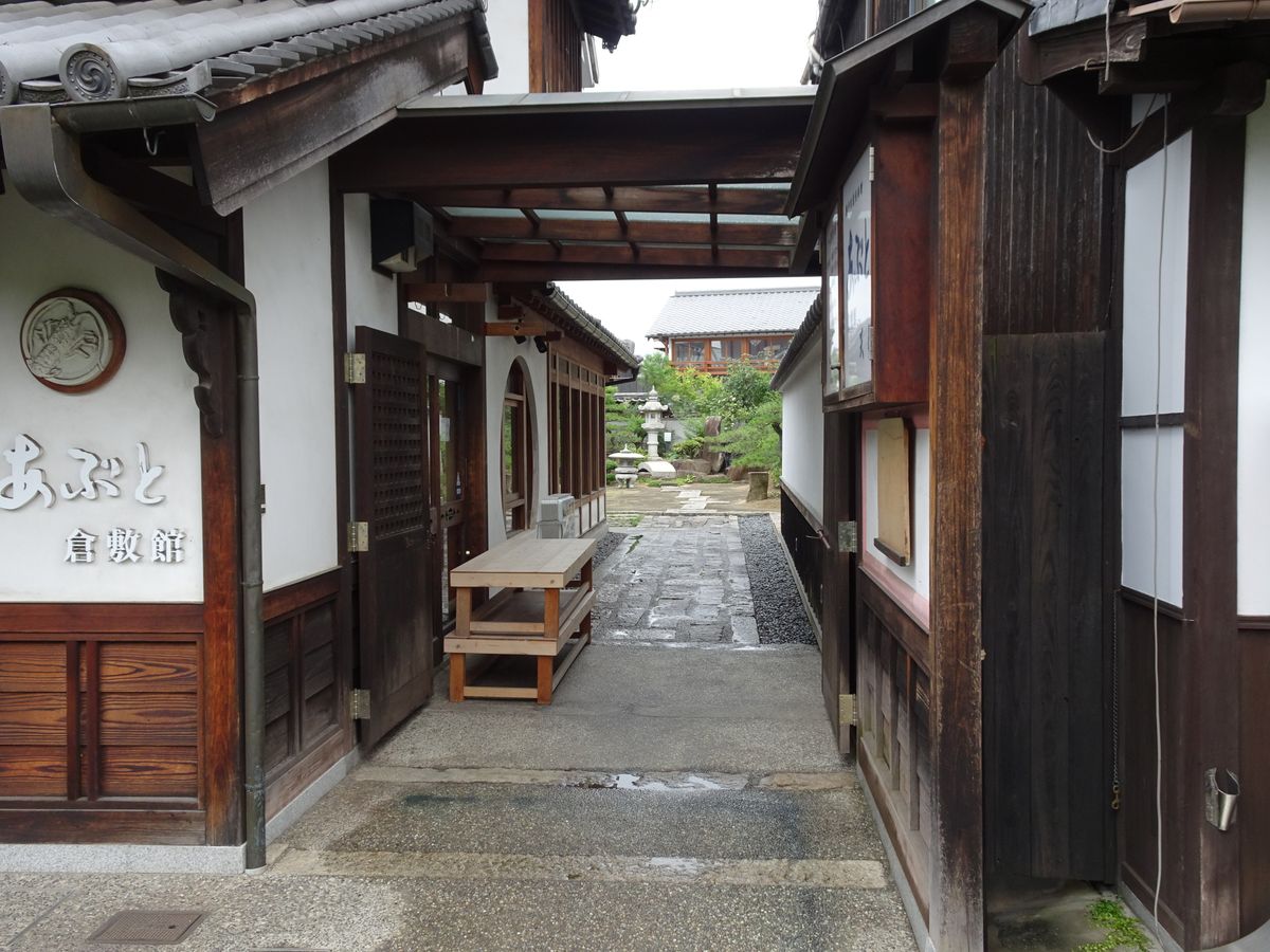 Traditional whitewashed merchant alleyway in Kurashiki's Bikan historical quarter, Okayama