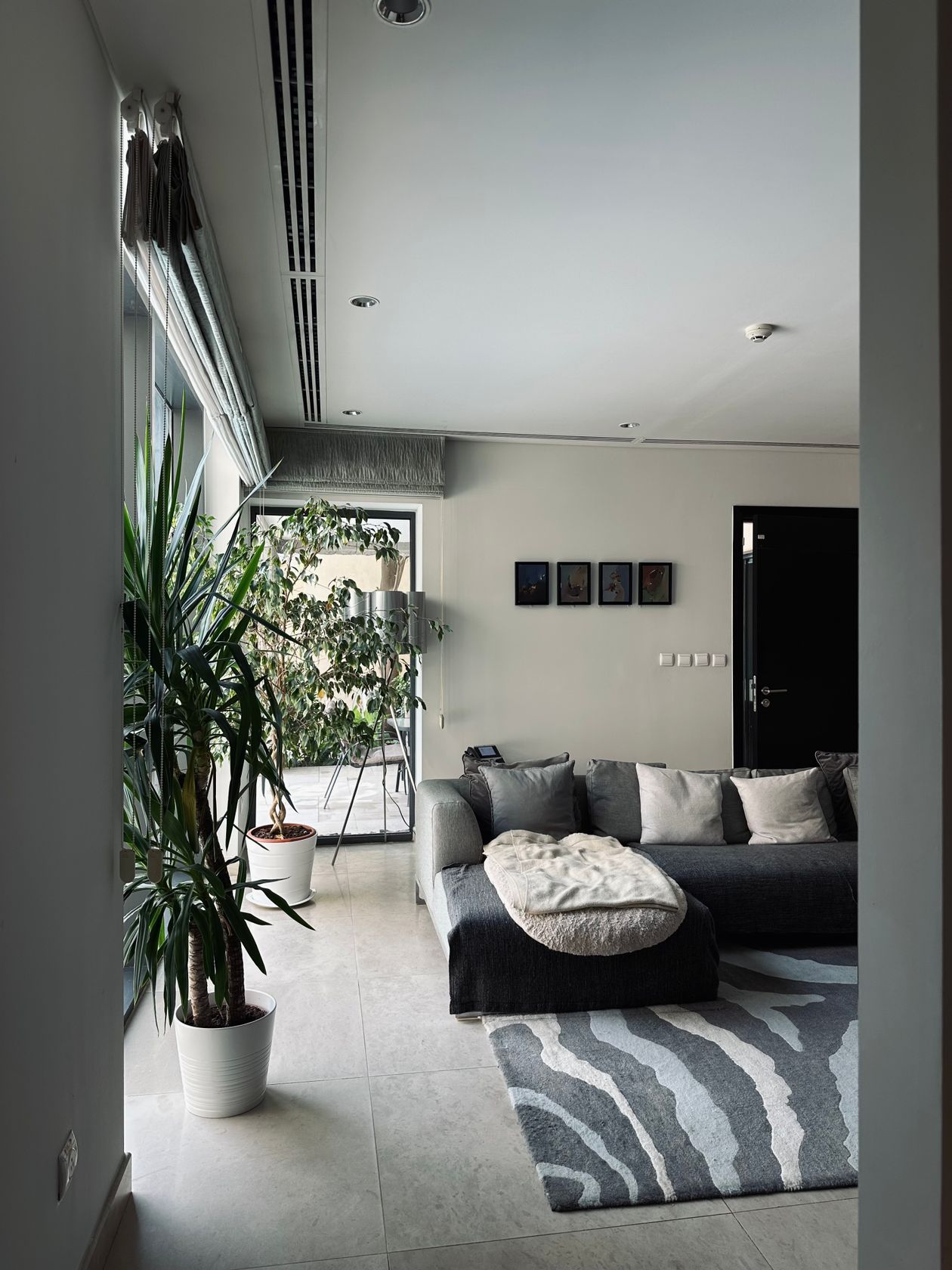 Gray abstract rug with white stripes in a modern living room