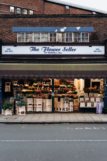Exterior view of The Flower Seller shop in Muswell Hill, London with vibrant floral display.