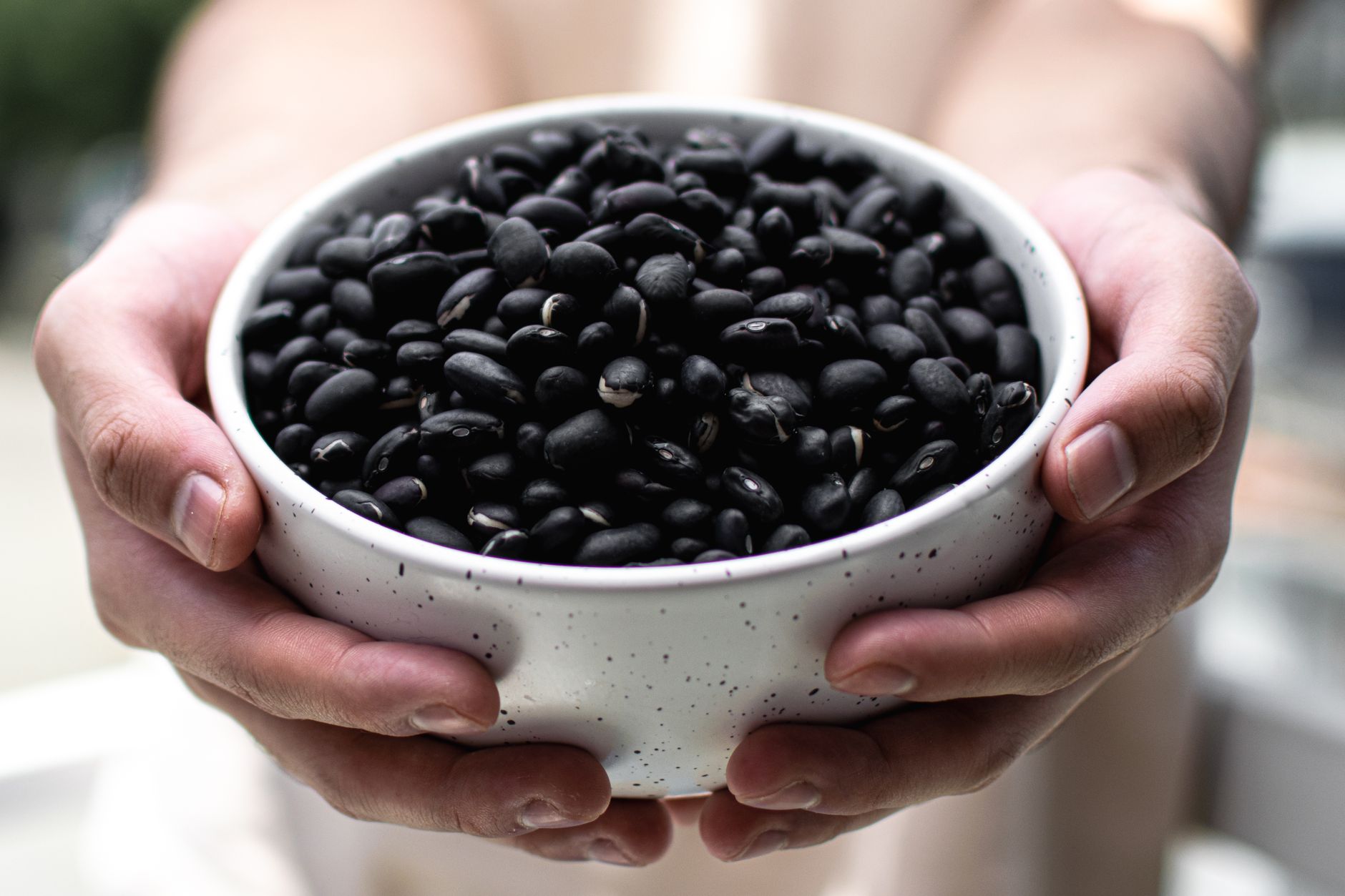 Fresh black beans in a clear package with Halal certification label visible