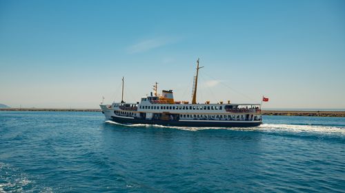 Free Relaxing ferry trip on the Bosphorus, capturing the essence of Istanbul's maritime charm under a clear summer sky. Stock Photo