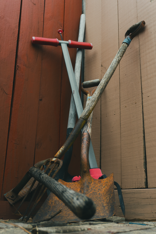 Rustic Garden Tools Rustic Gardening Tools Against Wooden Fence · Free Stock Photo