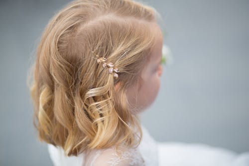 Free Brass Hair Clip on Little Girl's Hair Stock Photo