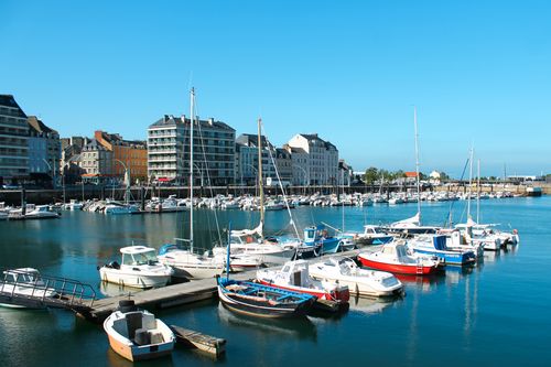 Free Bright day at Cherbourg Marina, Normandy with boats and colorful buildings along the waterfront. Stock Photo
