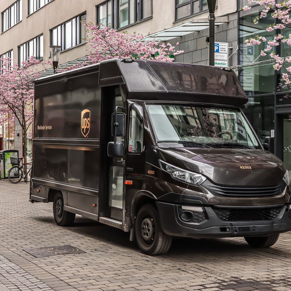 Mickleton — movers delivering furniture from a van