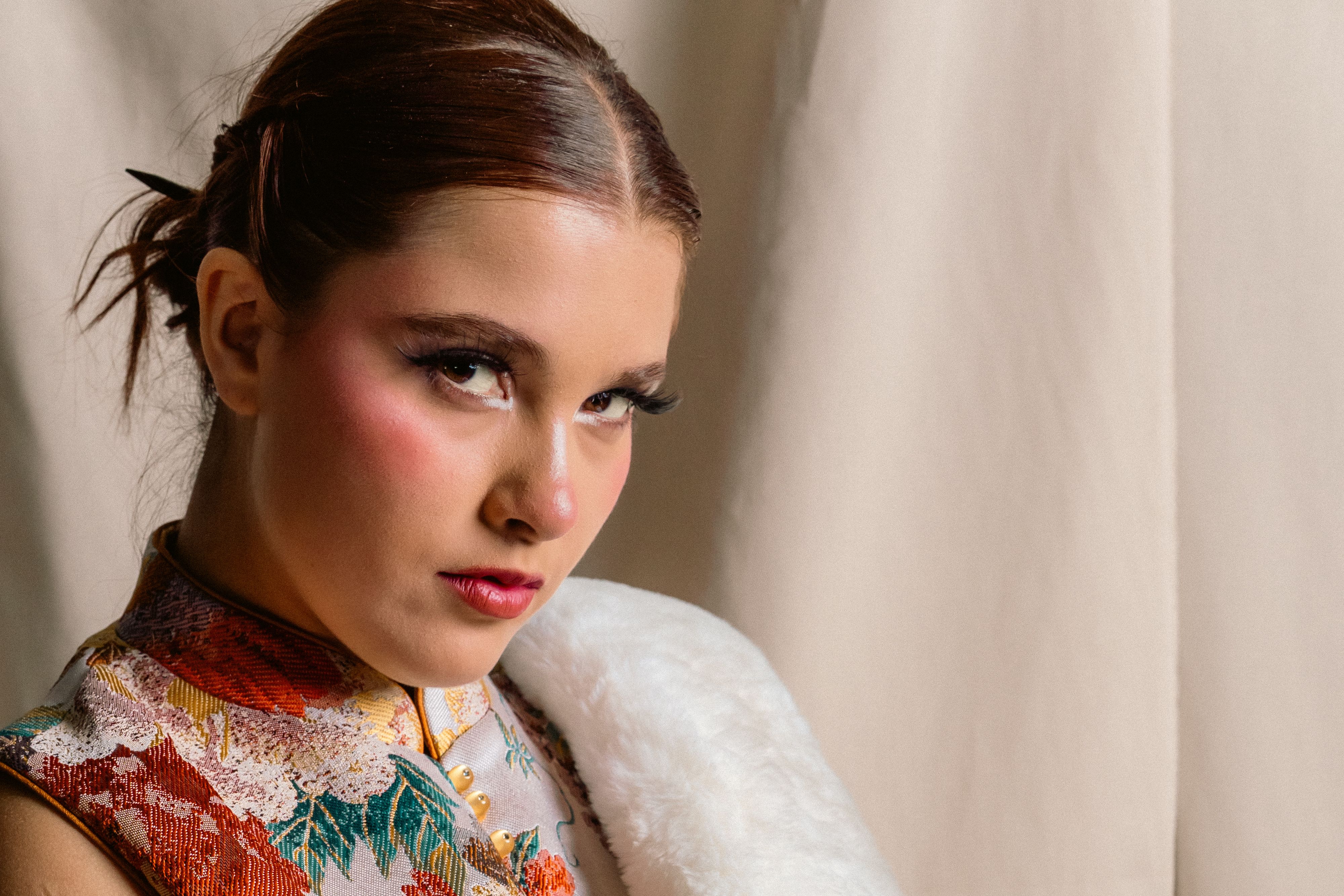 Elegant Portrait of a Young Woman in Floral Attire · Free Stock Photo