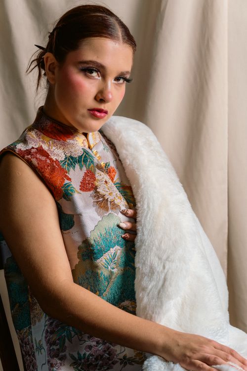 Free Beautiful portrait of a woman in vibrant traditional attire, adding a touch of elegance. Stock Photo