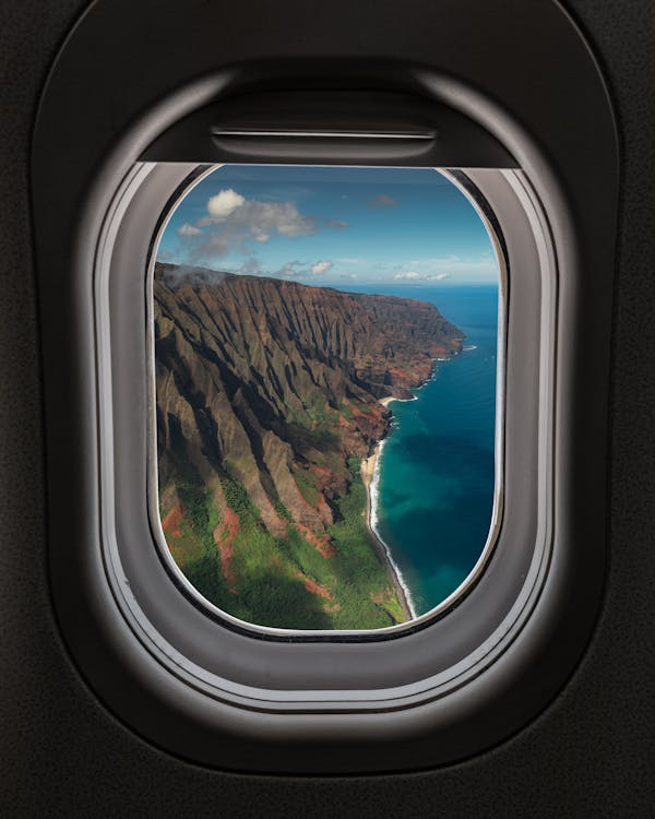 Free Brown Mountain View from an Airplane Window Stock Photo