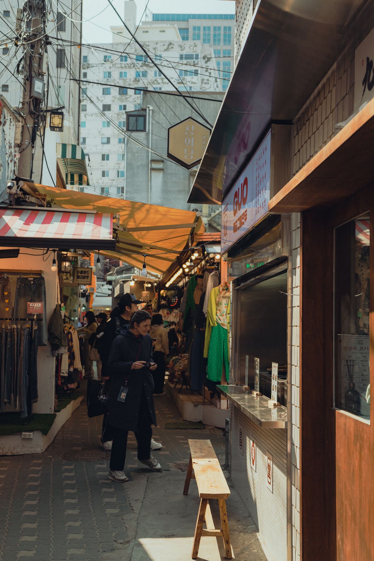 A Seoul market street. Confirm payment methods with the individual merchant.