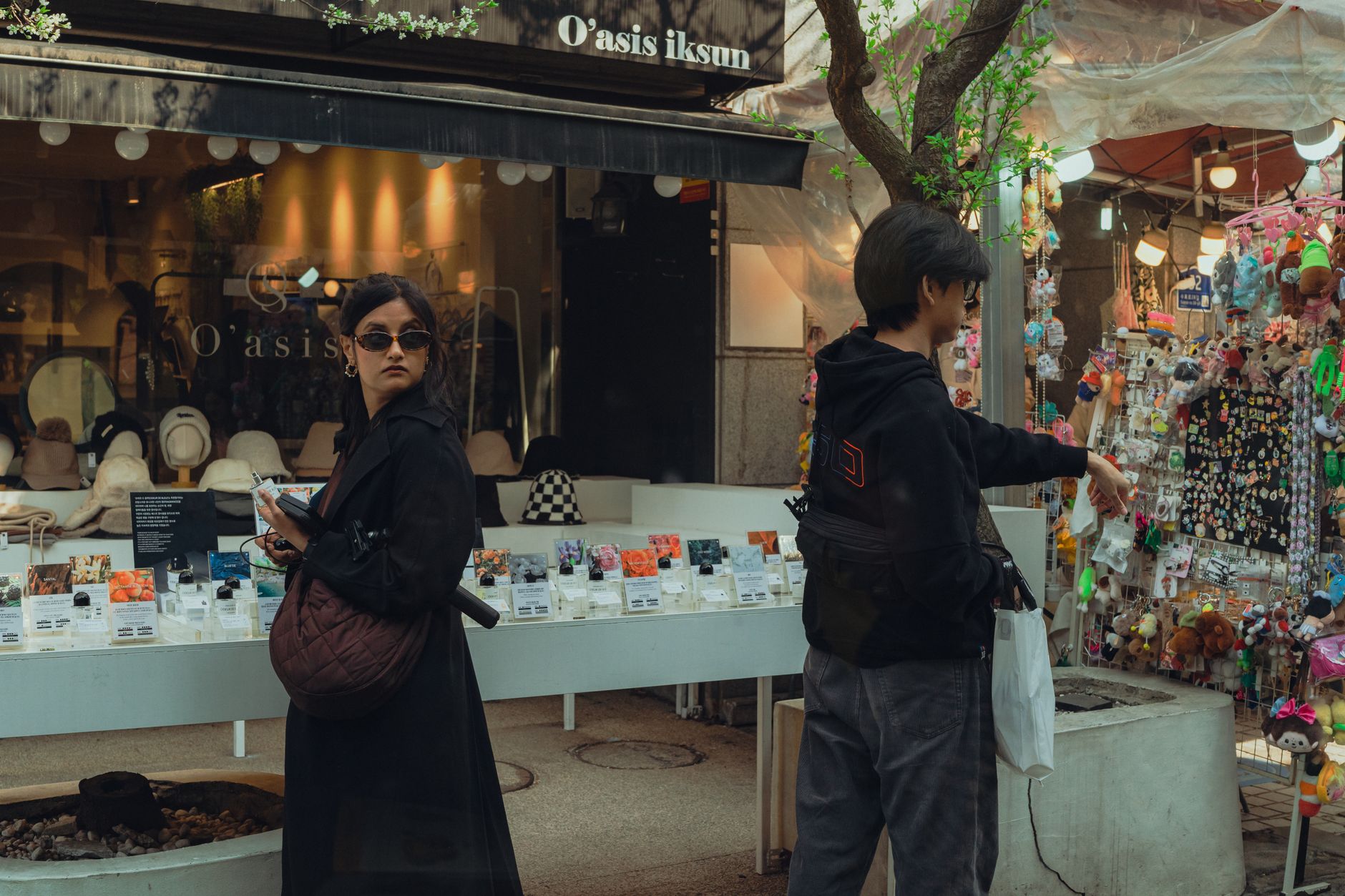 Vibrant street scene in Ikseon-dong, Seoul with people shopping in a lively market.