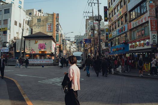 Vibrant street scene in Seoul, capturing urban life and architecture in springtime.