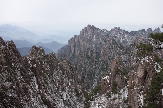 Breathtaking view of snow-covered mountain peaks in a serene landscape.