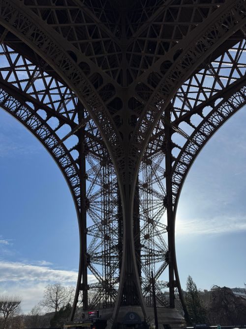 Free Explore the intricate design of the Eiffel Tower from below, capturing its architectural beauty. Stock Photo