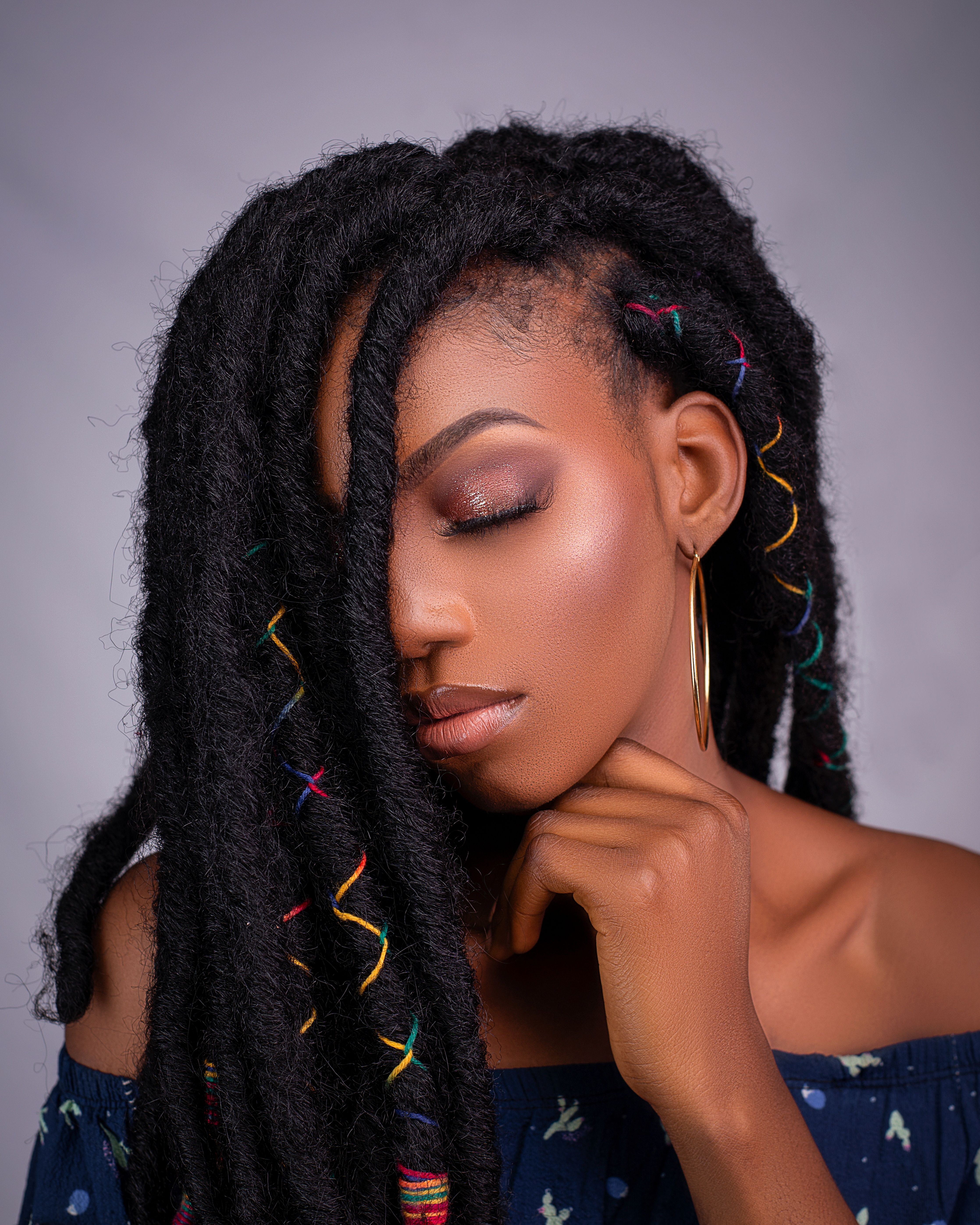 Elegant Portrait of a Woman with Braided Hair · Free Stock Photo