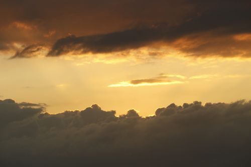 Free Dramatic sunset with golden clouds over Guaratuba, Paraná, Brazil. Captured with a Canon EOS Rebel T5. Stock Photo