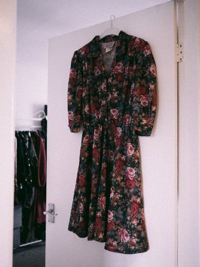 Vintage floral dress on a hanger — photo by Lisa from Pexels