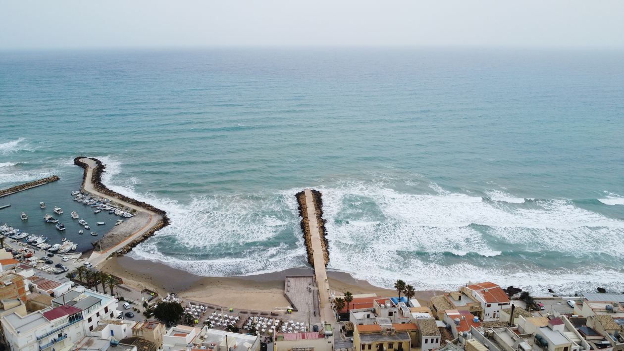 Aerial View of Mediterranean Coastal Town and Harbor · Free Stock Photo