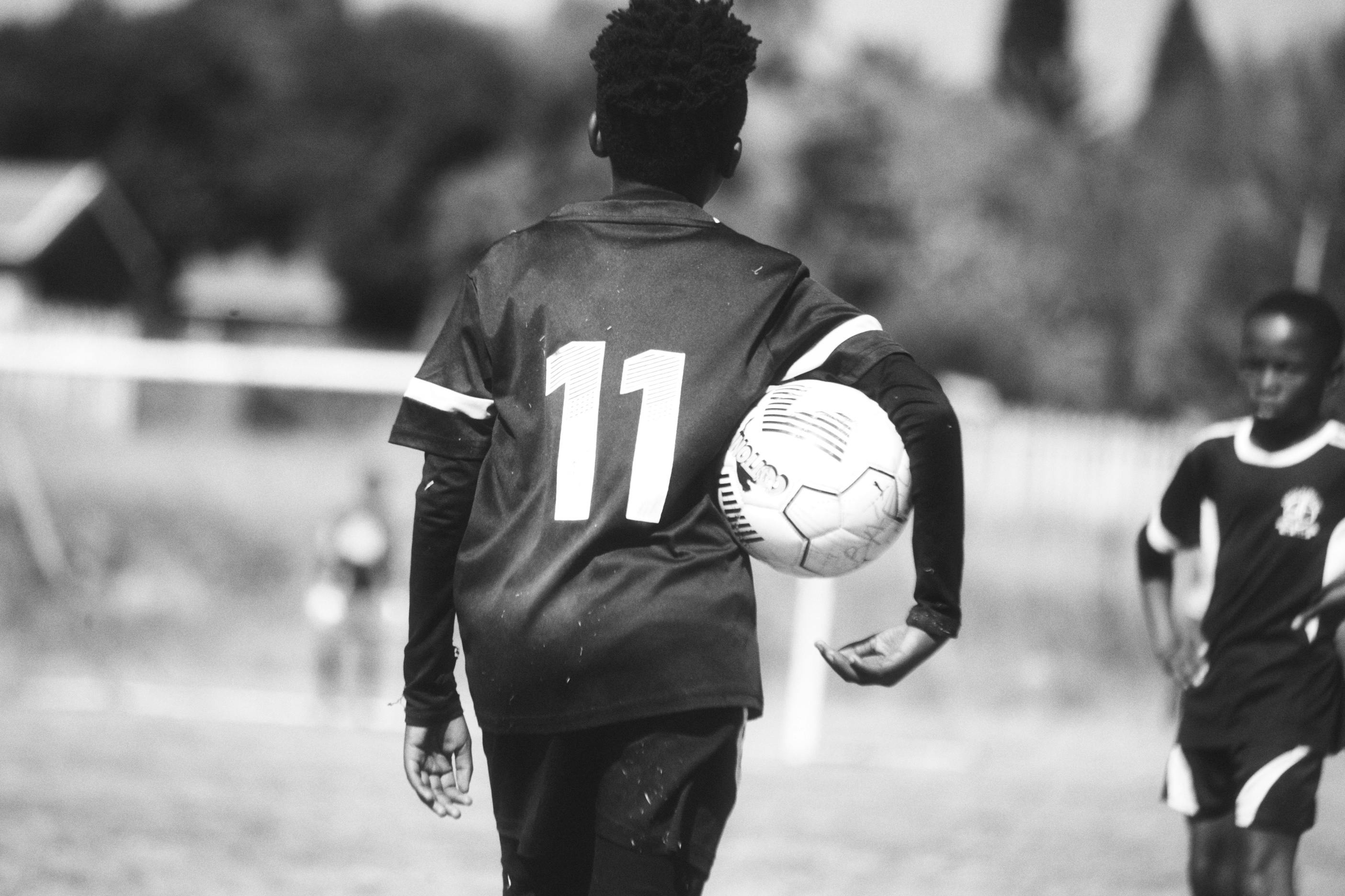 Youth soccer action in black & white