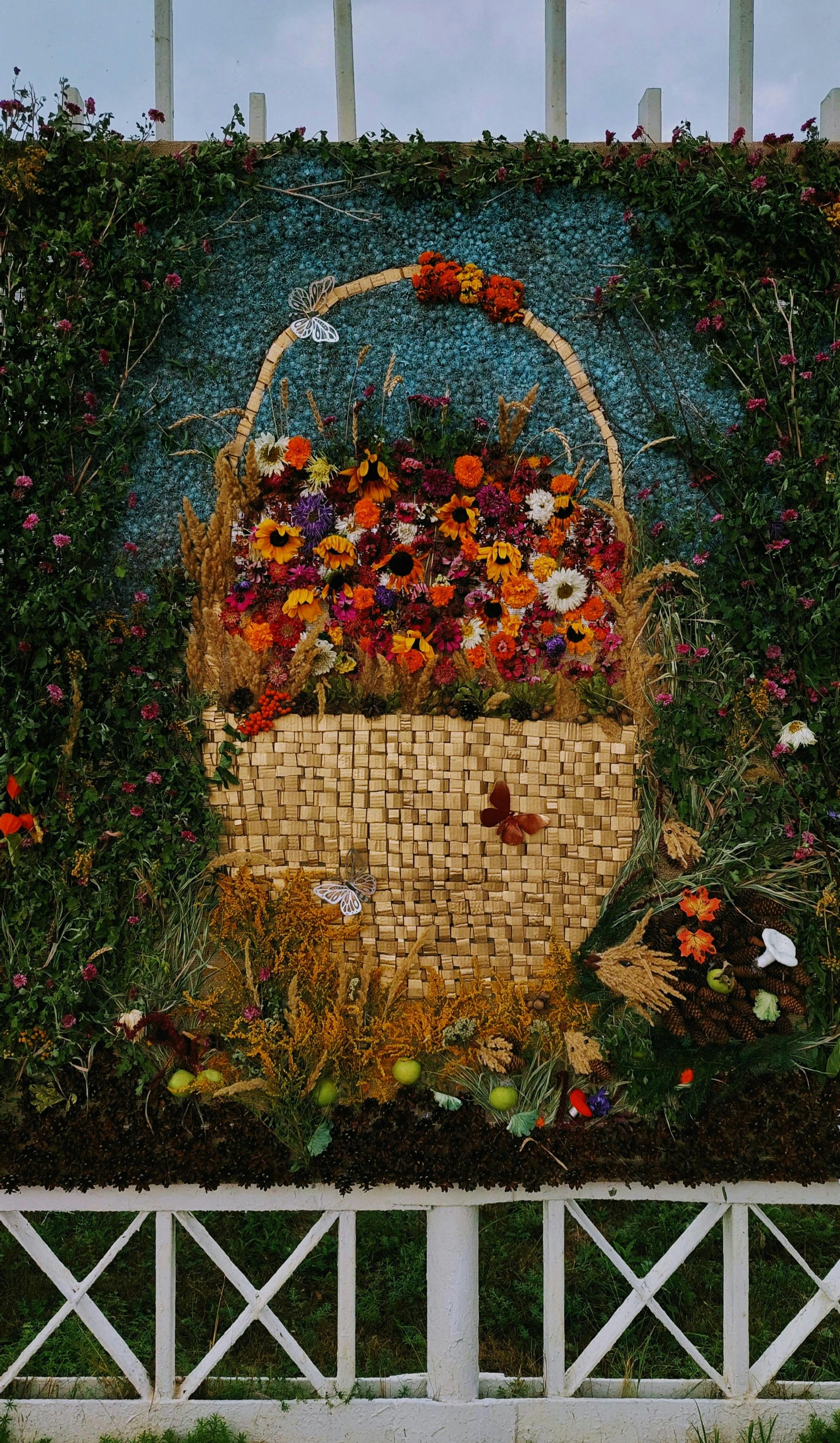 Captivating floral basket artwork featuring vibrant meadow flowers in Naberezhnye Chelny, Tatarstan.