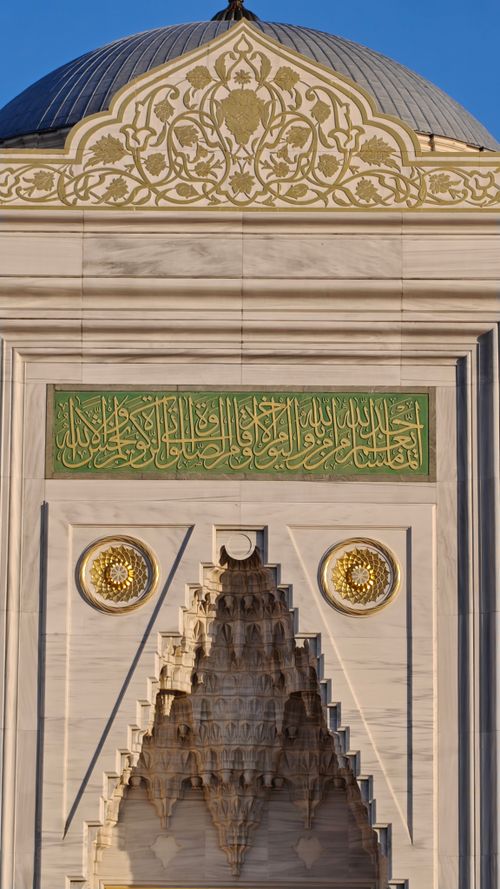 Free Detailed view of a mosque facade in Istanbul showcasing Islamic architectural elements. Stock Photo