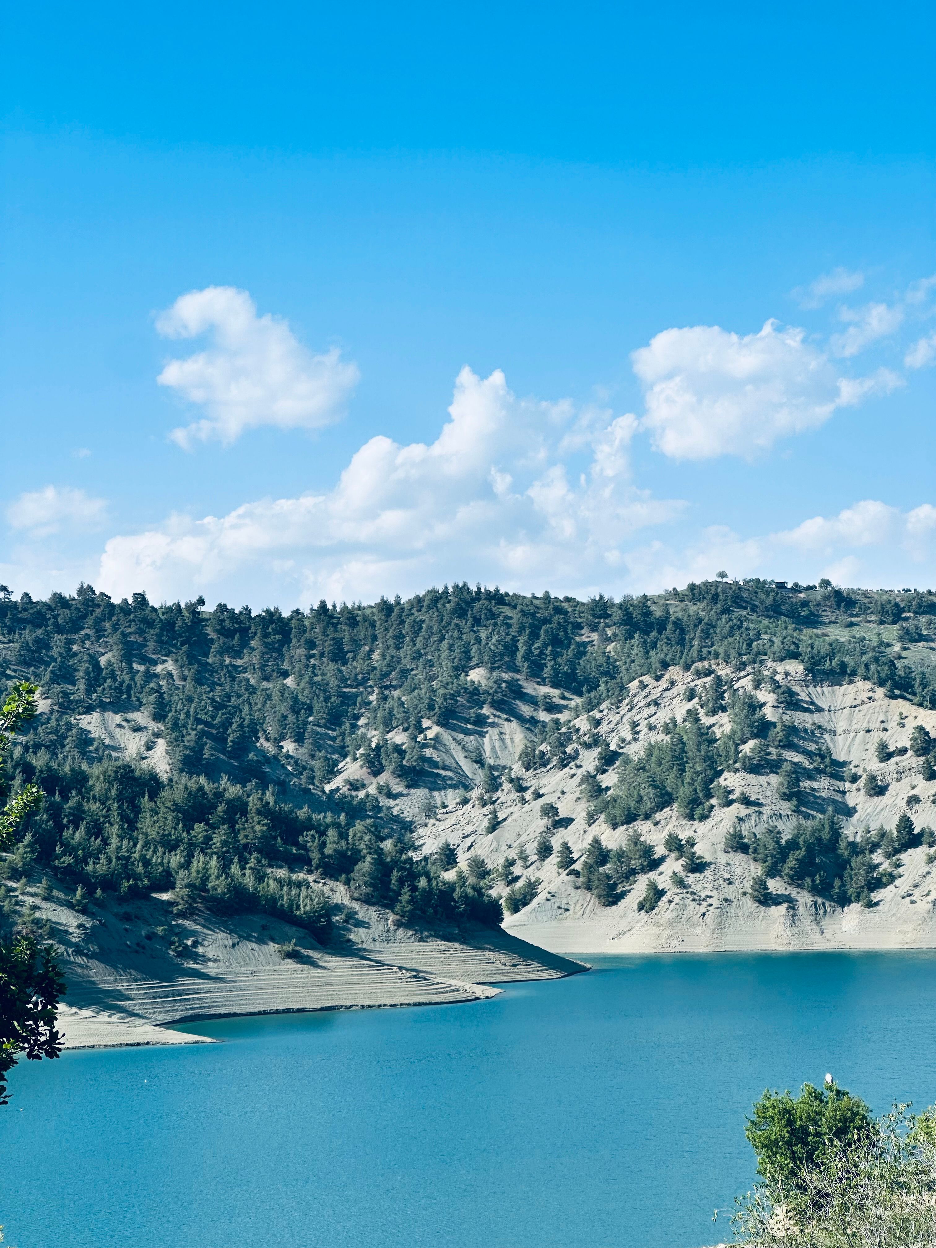 Serene Mountain Lake Under Clear Blue Sky · Free Stock Photo
