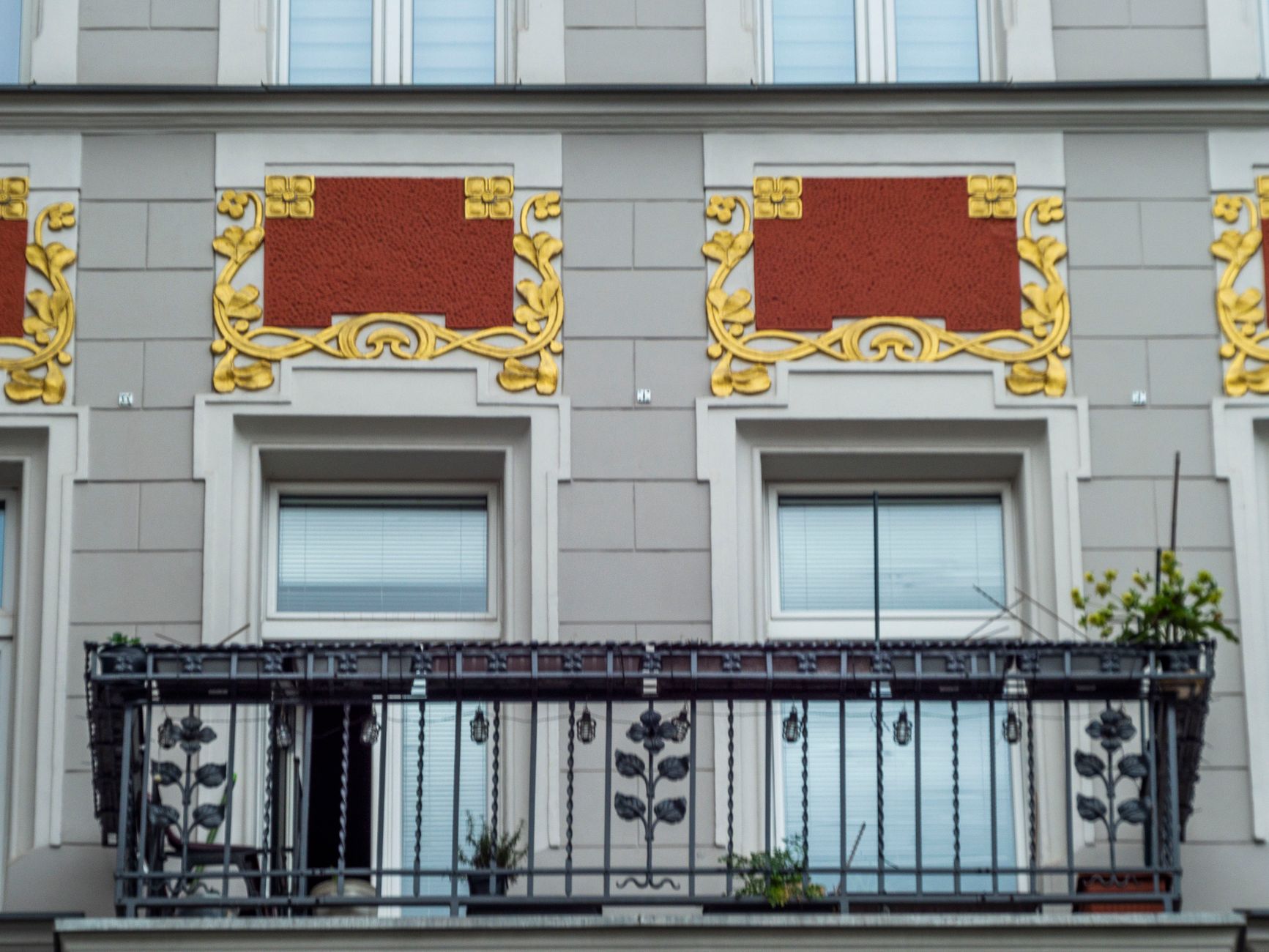 Close-up of an ornate Art Nouveau building facade with intricate balcony and decorative details.. close, ornate, nouveau