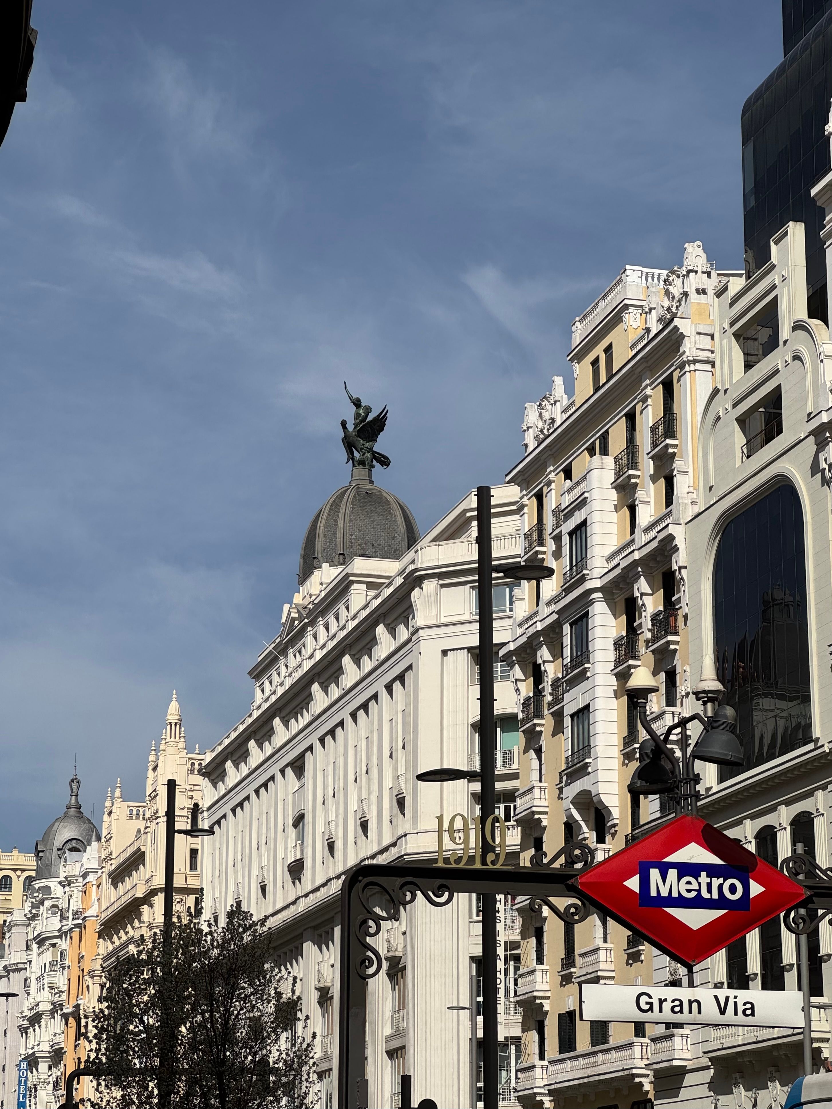 iconic-gran-via-street-in-madrid-with-metro-sign-free-stock-photo