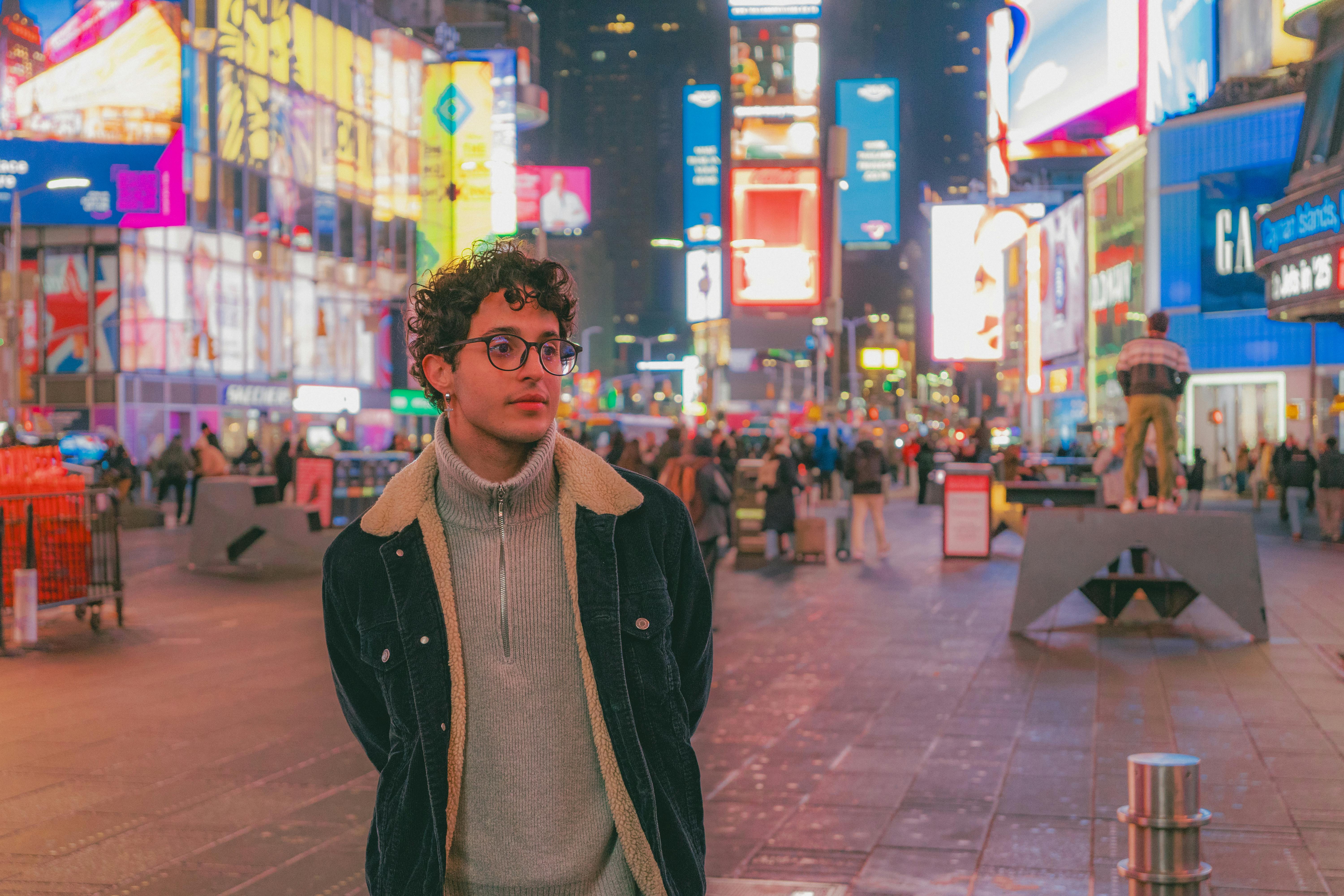 body treatments Floral Park NY - Portrait of a young adult in Times Square, NYC, highlighting the vibrant city nightlife.