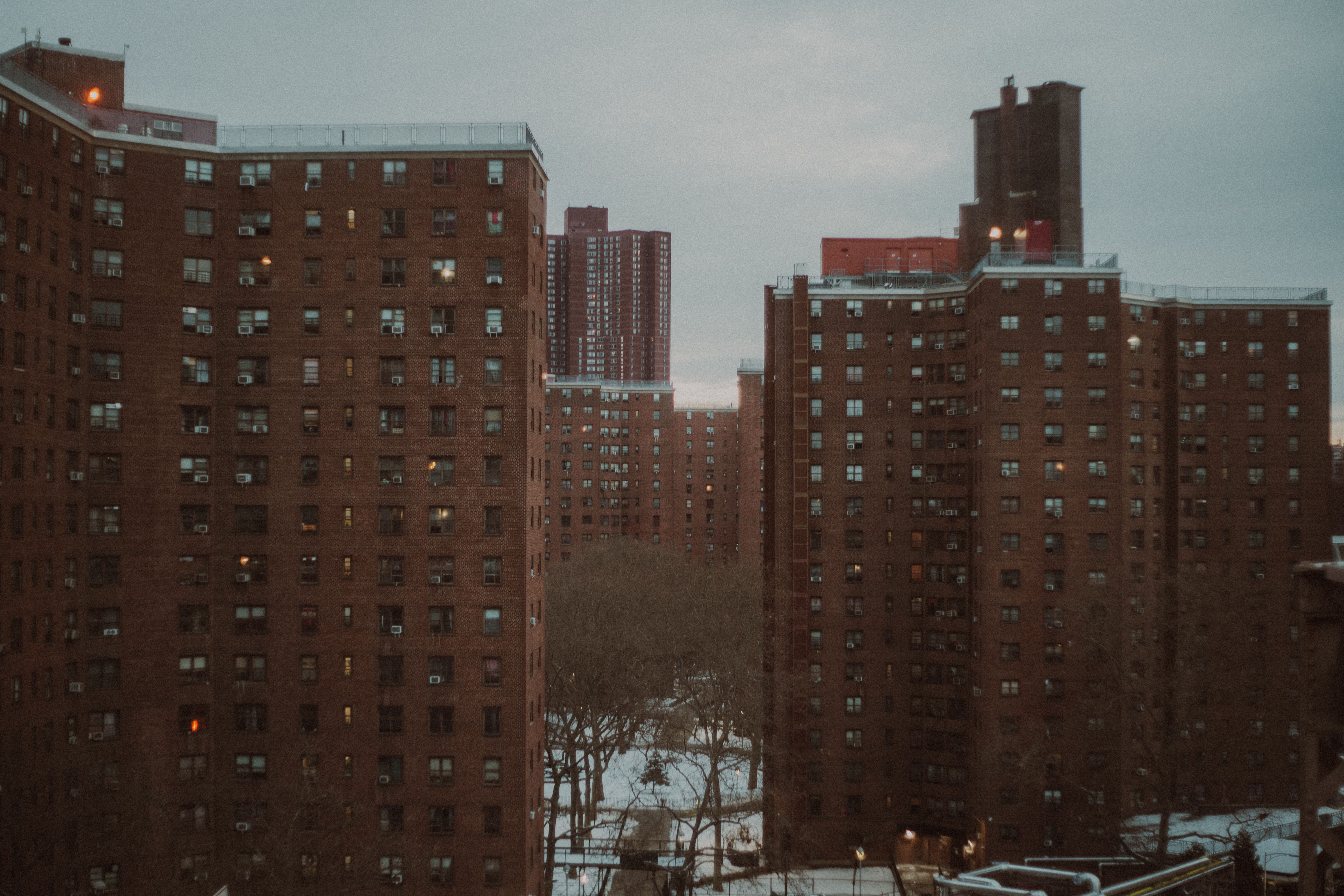 Urban New York City apartment buildings at dusk, showcasing winter ambiance.