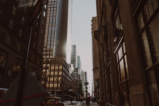 A captivating view of New York City's architecture with urban street life at daytime.