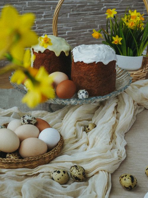 Free Festive Easter table with traditional cakes, eggs, and spring flowers. Stock Photo