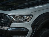 Close-Up of Modern SUV Headlight in Outdoor Setting