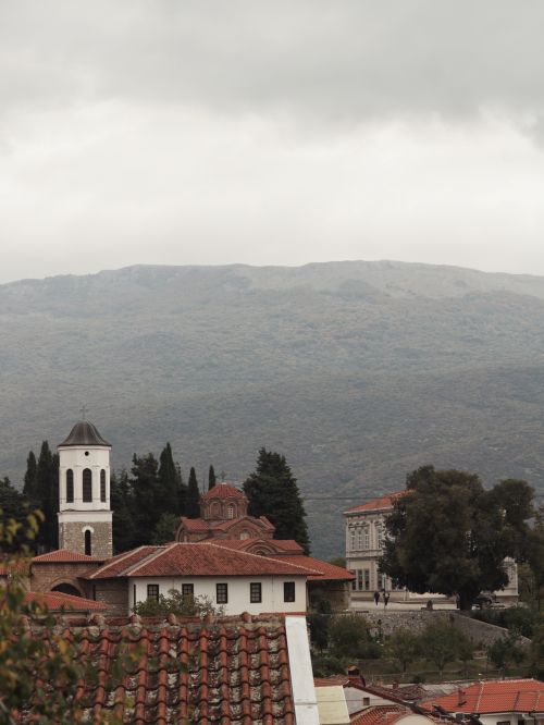 Free Explore the charming historical architecture of Ohrid, North Macedonia with mountain views. Stock Photo