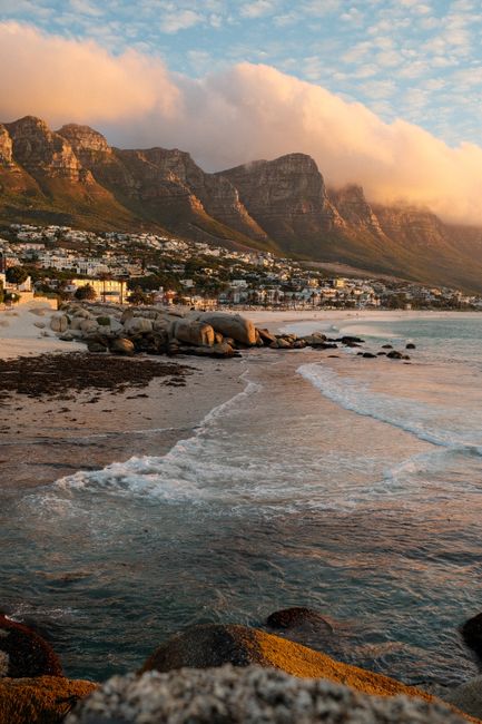 Stunning sunset over Cape Town's Twelve Apostles and Camps Bay Beach.