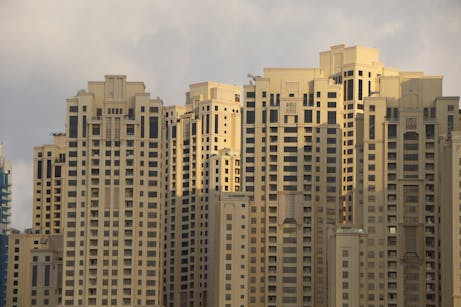 A close-up view of modern high-rise buildings in Dubai Marina, showcasing architectural detail and luxury living.