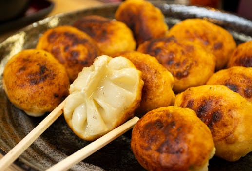 Close-up of golden Japanese dumplings in an authentic setting.